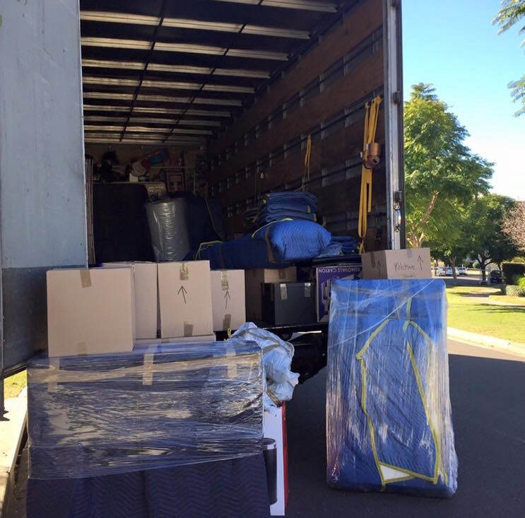 2 Bedrooms Removalist Sydney team lifting furniture in apartment